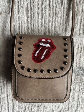 Rolling Stones Crossbody Bag with Red Sequin Tongue accent.